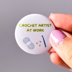 Crochet artist at work - crochet pin badge